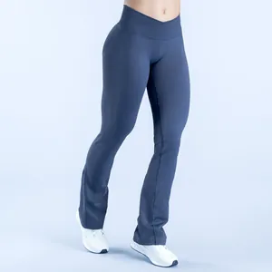 Detailed view of seamless flare yoga pants featuring a stylish cross waist and lift design
