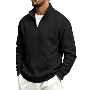 Detail of men's black half-zip sweatshirt showing stand collar and kangaroo pocket.