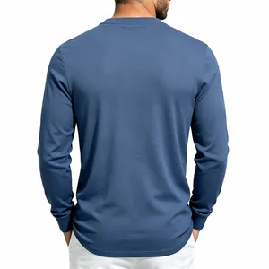 Back view of a premium blue men's long-sleeve Henley shirt showing knit fabric texture