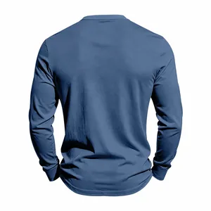 Back view detail of a men's loose fit solid navy blue knit long sleeve Henley shirt