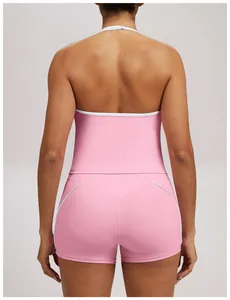 Back view of pink halter neck yoga set showing white piping and seamless fabric design