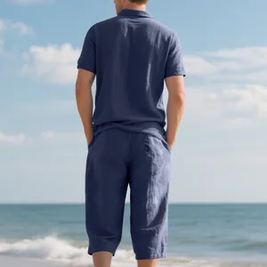 Back view of men's navy blue linen polo shirt and three-quarter pants beach set.