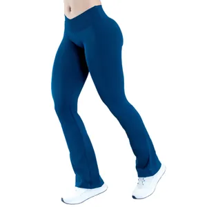 High-waist crossover yoga flare pants in dark blue featuring seamless hip-lifting design