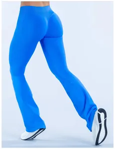 Close-up view of bright blue seamless flared yoga pants showing athletic butt-lifting fit