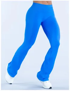 Vibrant blue seamless yoga flare pants on a model, showcasing flexible fit and athletic style