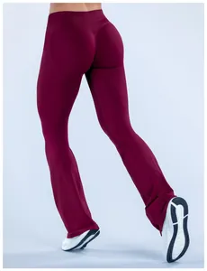Detailed view of burgundy seamless flare yoga pants featuring a high-waisted slimming fit.