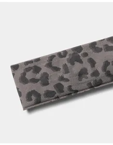 Close-up detail showing the knit texture and grey leopard print of a seamless sports headband.