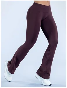 Detail of seamless flared yoga pants in deep burgundy for fitness and running sessions.