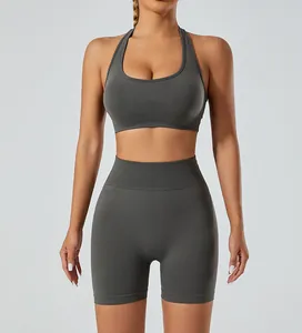 Front detail of a seamless grey halter-neck sports bra and high-waist fitness shorts set