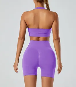 Back detail of a seamless purple yoga set featuring halter bra and scrunch shorts