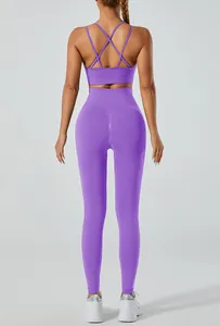 Back view of purple yoga set with criss-cross sports bra and high-waisted leggings