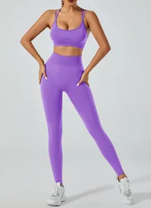 Front view of purple yoga set featuring backless sports bra and high waisted leggings