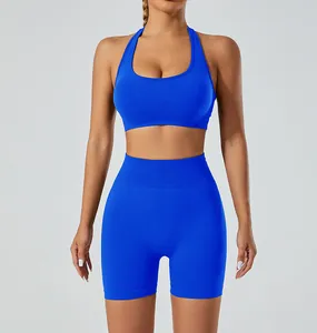 Front view of a vibrant cobalt blue seamless halter sports bra and high-waisted yoga shorts set
