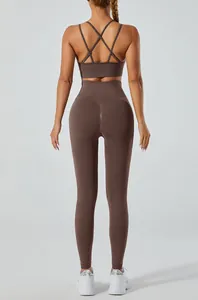 Rear view of brown yoga set featuring criss-cross sports bra and high-waisted leggings