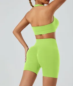 Back view of neon green seamless yoga set with halter sports bra and high-waisted shorts