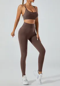 Seamless high-waist yoga set with brown strappy sports bra and matching leggings