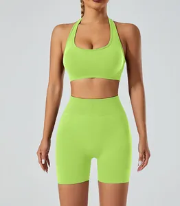 Front view of neon lime green seamless yoga set with halter sports bra and shorts