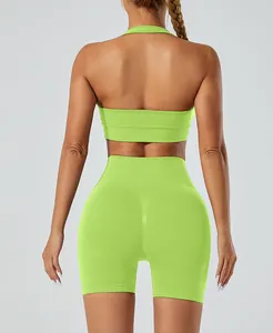 Back view of seamless lime green yoga set with halter sports bra and shorts