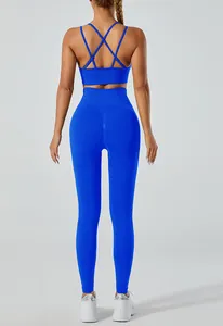 Back view of a vibrant blue yoga set with crisscross sports bra and high-waisted leggings