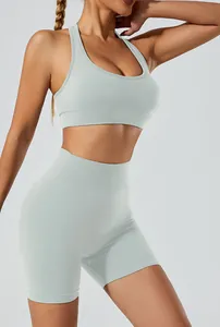 Detailed view of a seamless mint green yoga set featuring a sports bra and biker shorts
