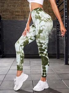Side profile detail of green and white tie-dye high-waisted lifting yoga leggings for women