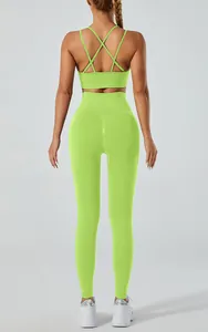 Back view of lime green yoga set with cross-strap bra and high-waist leggings