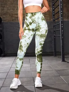 Detailed view of high-waisted tie-dye yoga leggings in a gym setting