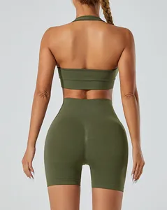 Back view of a seamless olive green yoga set with halter bra and high waist shorts.
