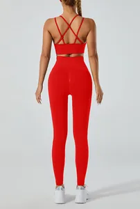 Detailed back view of high-waist red yoga set with sexy criss-cross back sports bra