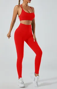 Vibrant red yoga set featuring a cross-back sports bra and high-waist seamless leggings