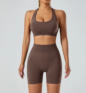 Front view detail of coffee seamless yoga set with halter bra and high waist shorts