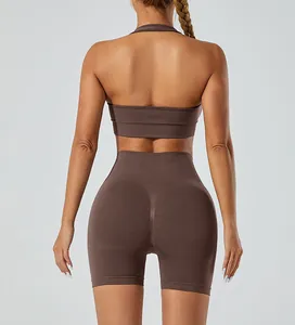 Back view of a brown seamless high-stretch halter sports bra and yoga shorts workout set.