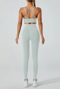 Back view of light blue yoga set with cross-back sports bra and high-waisted leggings.