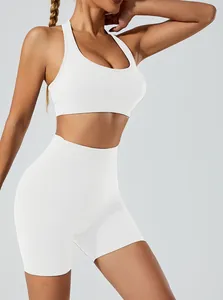 Detailed view of white seamless high-stretch yoga sports bra and shorts set for gym
