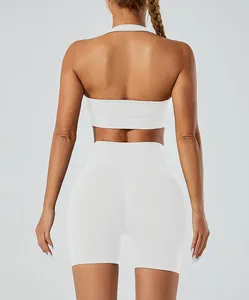 Back view of white seamless yoga set featuring halter bra and high-waist shorts