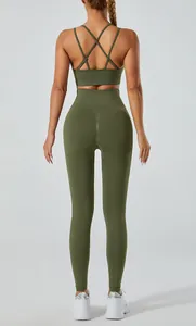 Back view of olive green two-piece yoga set with cross-back sports bra and leggings