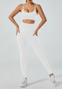 Detail view of white yoga set featuring backless sports bra and high waist leggings