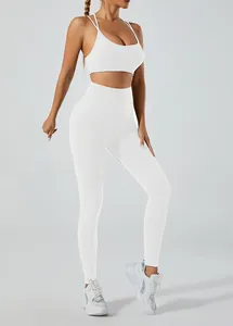 Side view of white two-piece yoga set with high waist leggings and cross-back bra