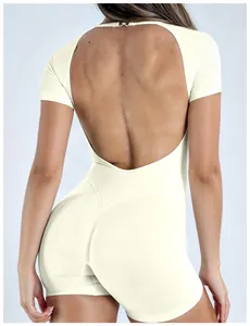 Close-up of white quick-dry yoga bodysuit featuring deep U-shaped open back design