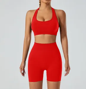 Red seamless yoga set featuring a halter sports bra and high-waisted gym shorts