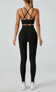 Back view of black yoga set featuring cross-strap bra and high-waist leggings