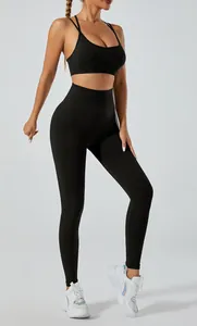 Detailed view of seamless black yoga set with high-waist leggings and sports bra.