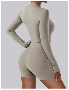 Back view of professional long-sleeved tight yoga jumpsuit in beige highlighting slim fit