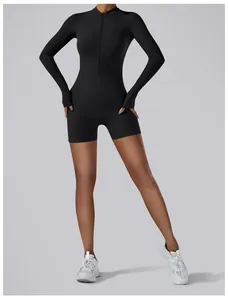 Detailed view of black long sleeve yoga bodysuit with front zipper and thumbholes.