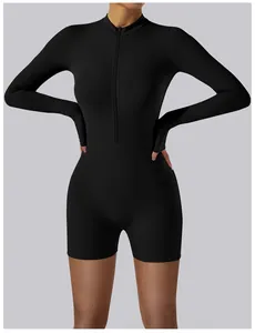 Detailed front view of a black long-sleeve one-piece yoga bodysuit with zipper