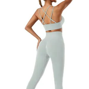 Mint green yoga set featuring a cross back sports bra and high waisted leggings