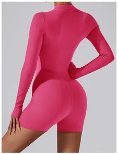 Detail view of the back seams and slim athletic fit on this pink long sleeve yoga bodysuit