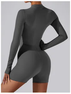 Detailed back view of a sleek dark grey long sleeve athletic bodysuit for yoga and gym
