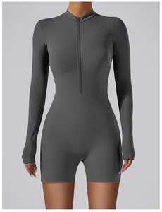 Close-up detail of a grey long sleeve one-piece yoga jumpsuit featuring a front zipper