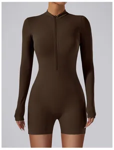 Detailed view of the brown long-sleeved yoga bodysuit with a functional front zipper
